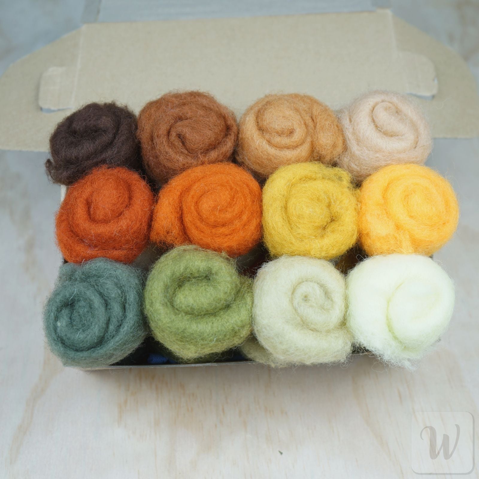 Carded Maori wool set featuring 12 warm forest colours, soft fluffy texture, 27 microns