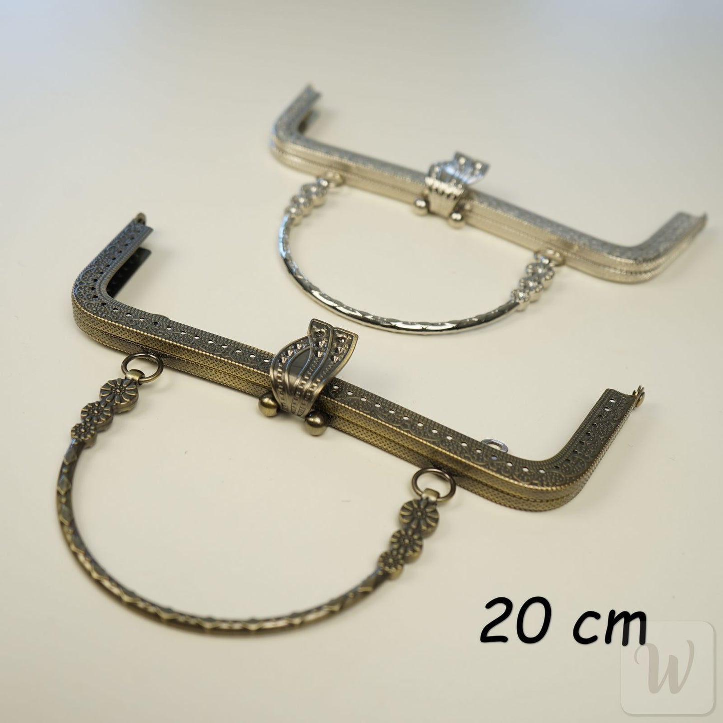 Vintage-style bronze metal purse frame with handle, 20cm wide, featuring decorative clasp and pre-punched holes for DIY bag making