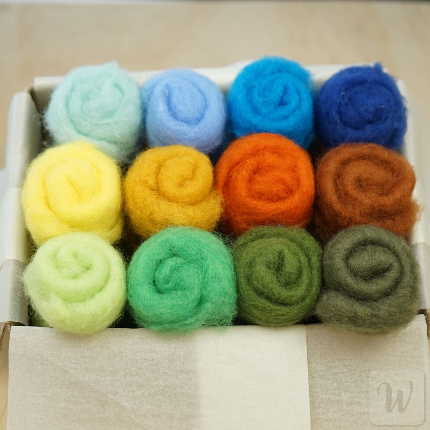 Carded Maori wool set featuring 12 bright nature colours, soft fluffy texture, 27 microns