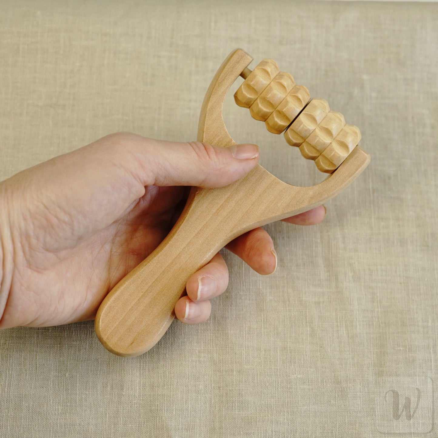 Natural wooden massage roller for wet felting with smooth polished surface and ergonomic design