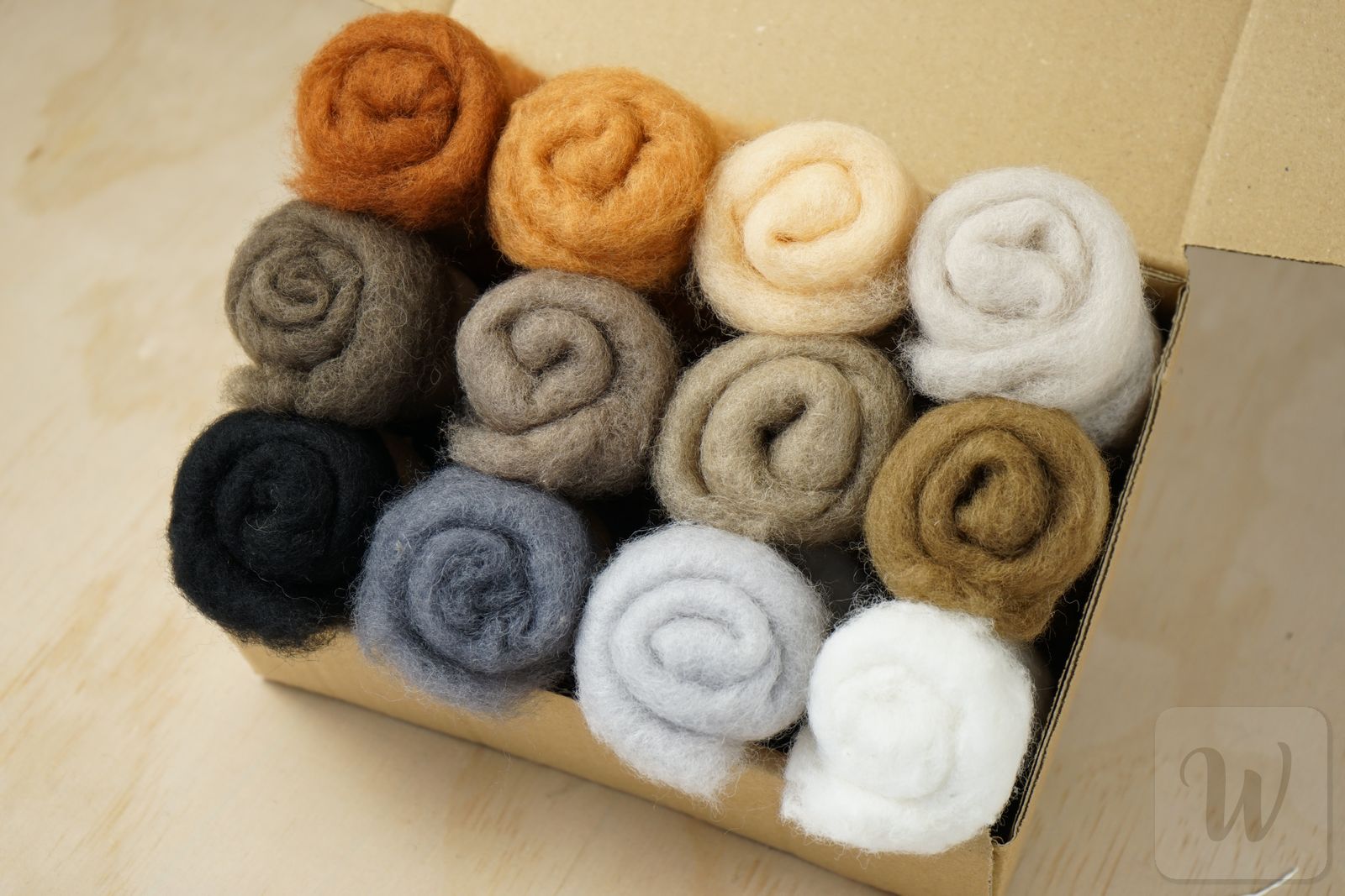 Carded Maori wool set featuring 12 vibrant animal mix colours, soft fluffy texture, 27 microns