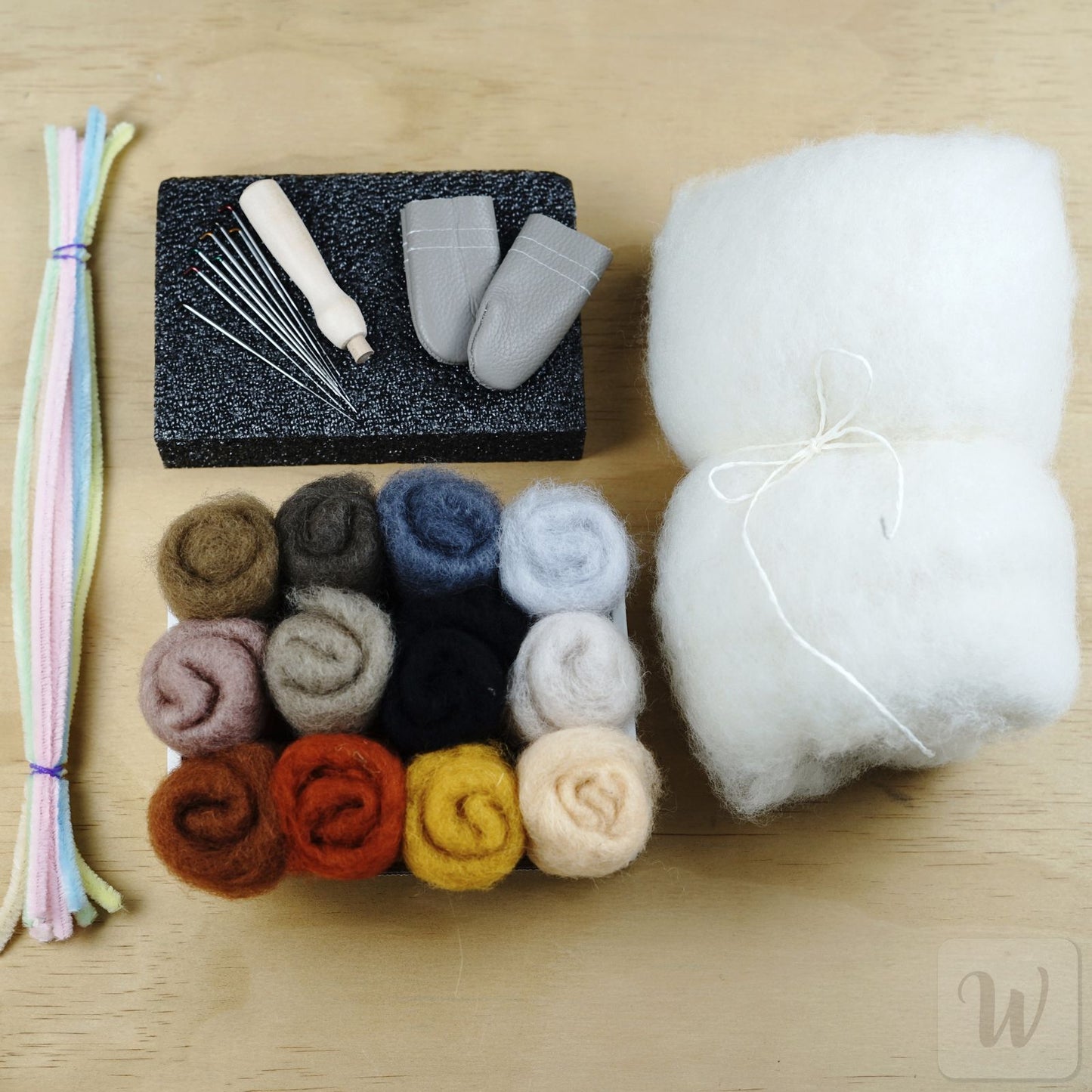 Complete needle felting beginner kit with 12 wool colours, 8 needles, wooden handle, foam mat and essential tools