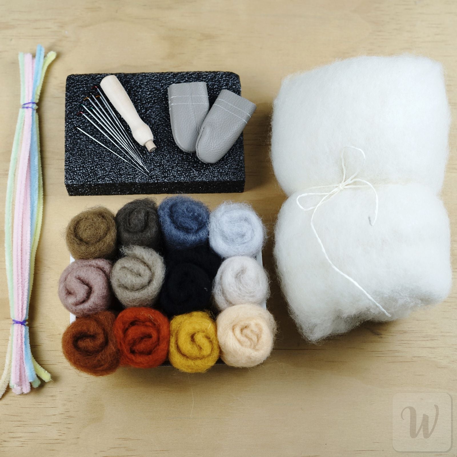 Complete needle felting beginner kit with 12 wool colours, 8 needles, wooden handle, foam mat and essential tools