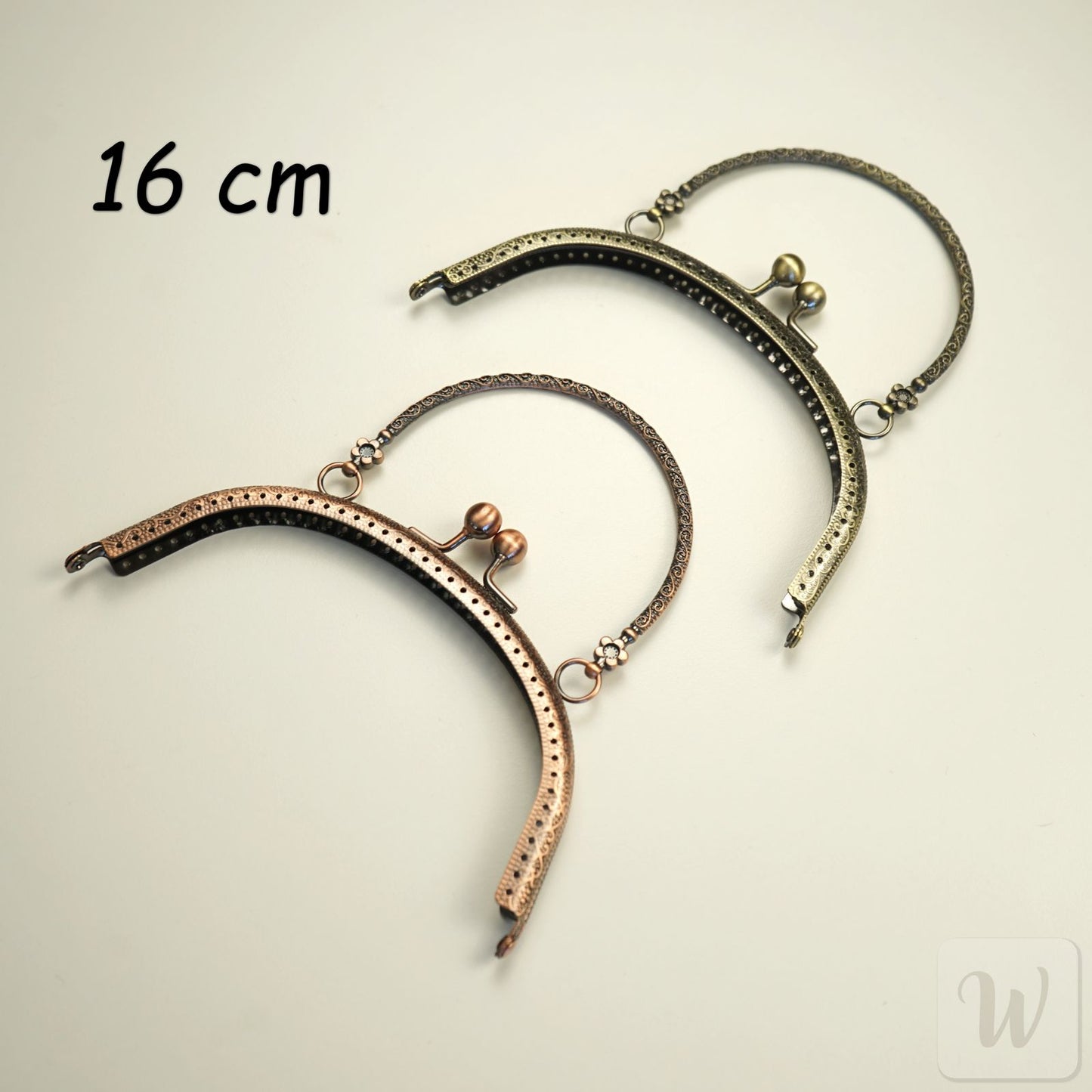 Vintage-style brass metal purse frame with handle, 16cm wide, featuring decorative clasp and pre-punched holes for DIY bag making"