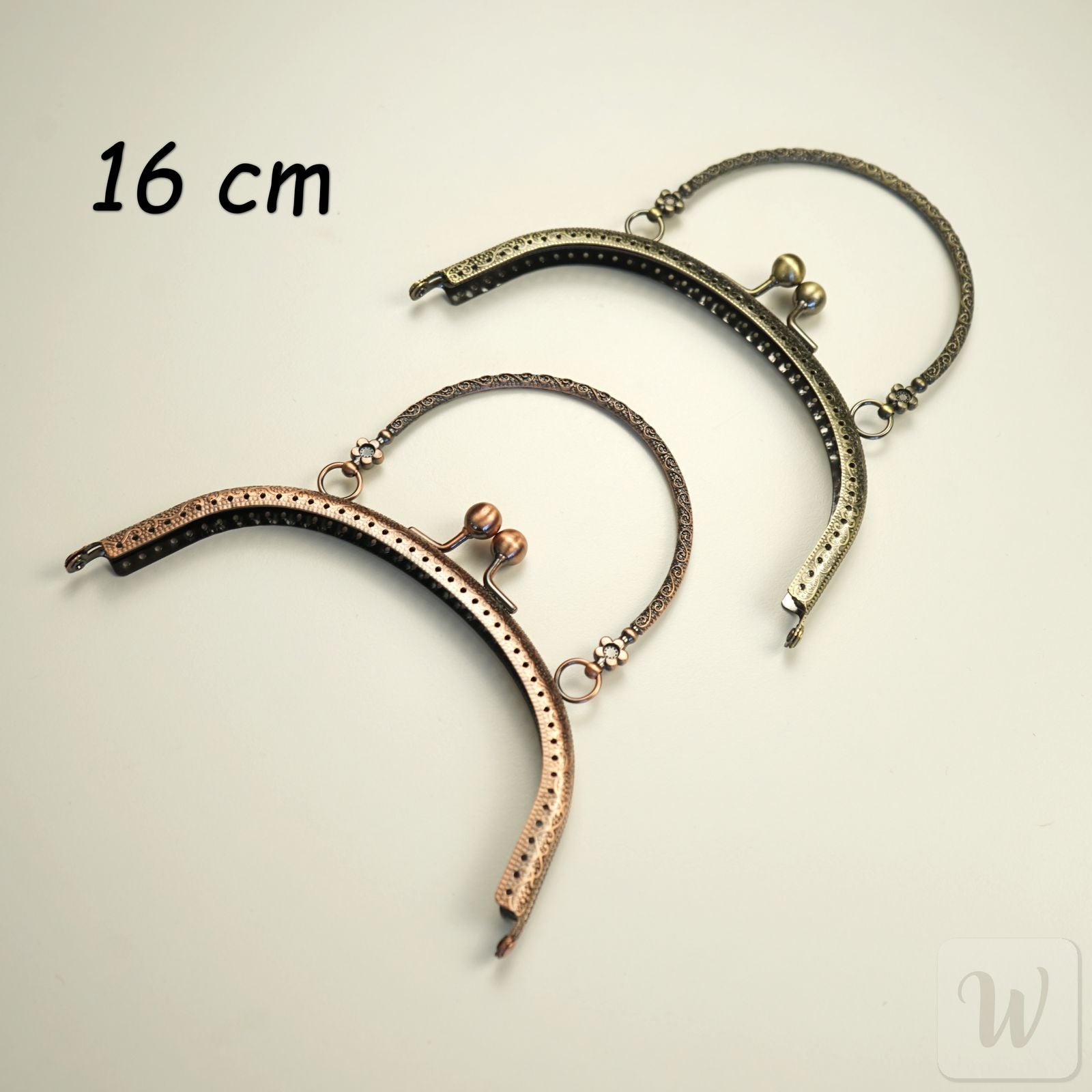 Vintage-style brass metal purse frame with handle, 16cm wide, featuring decorative clasp and pre-punched holes for DIY bag making"