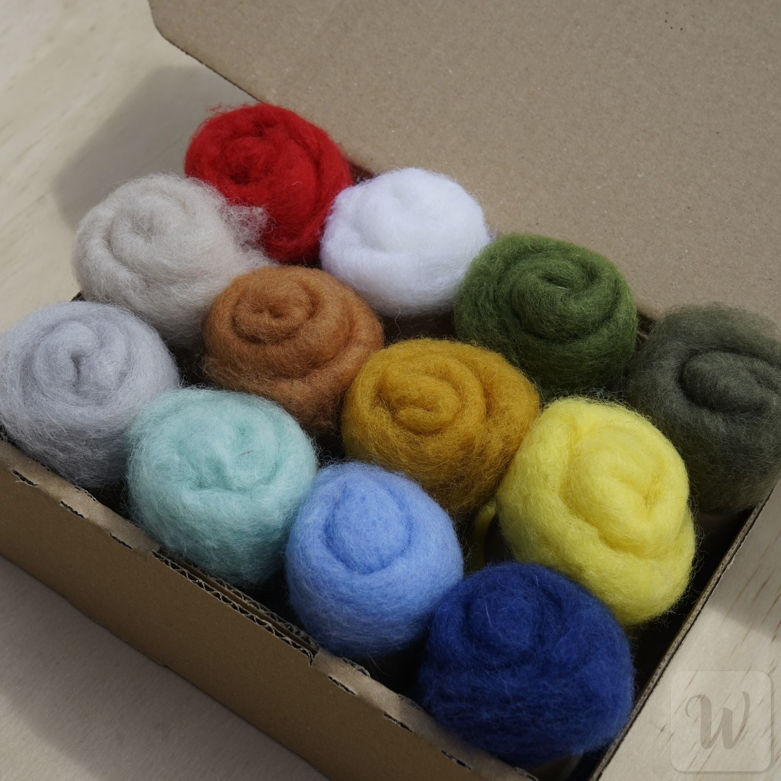 Carded Maori wool set featuring 12 vibrant vivid colours, soft fluffy texture, 27 microns