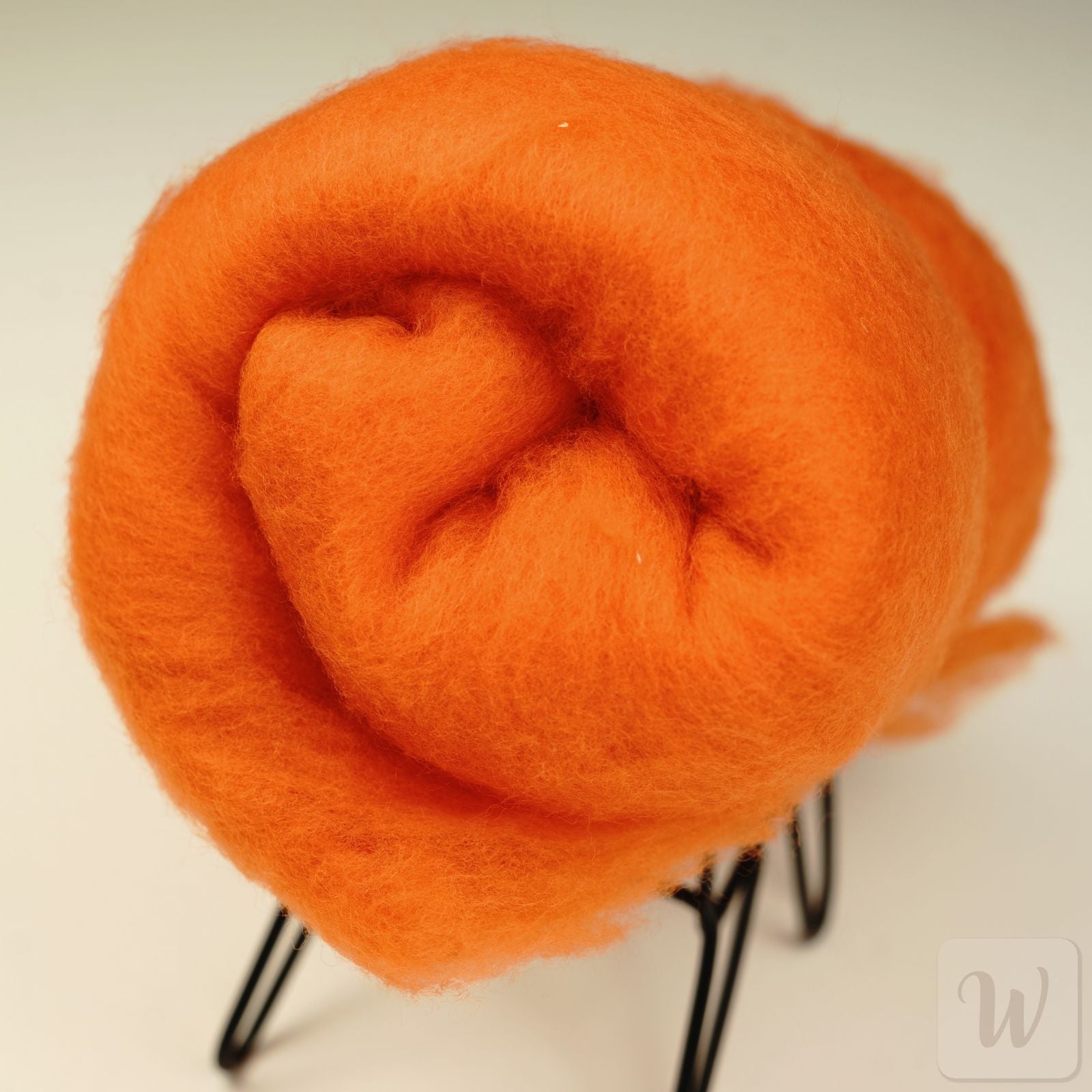 Extra fine merino wool in vibrant orange color, soft and airy texture, perfect for needle and wet felting