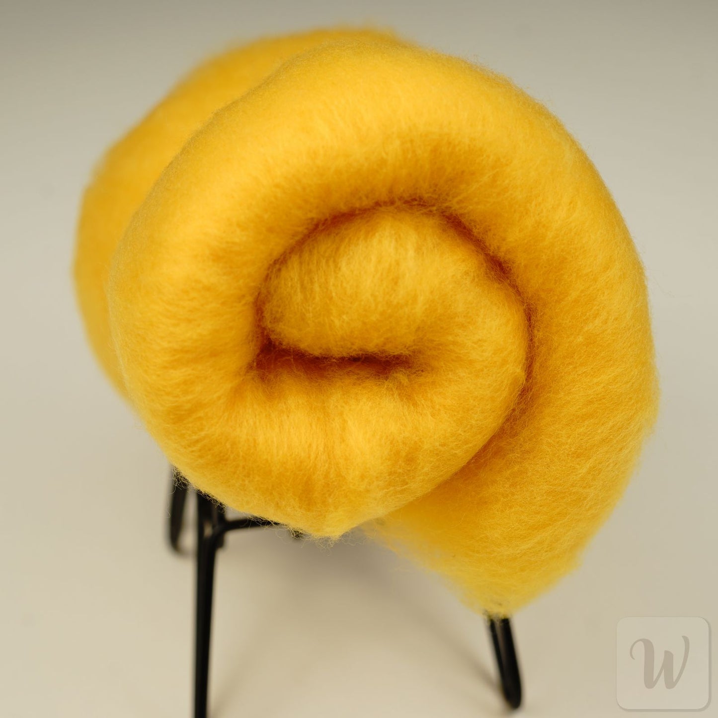 Extra fine merino wool in yolk color, soft and airy texture, perfect for needle and wet felting